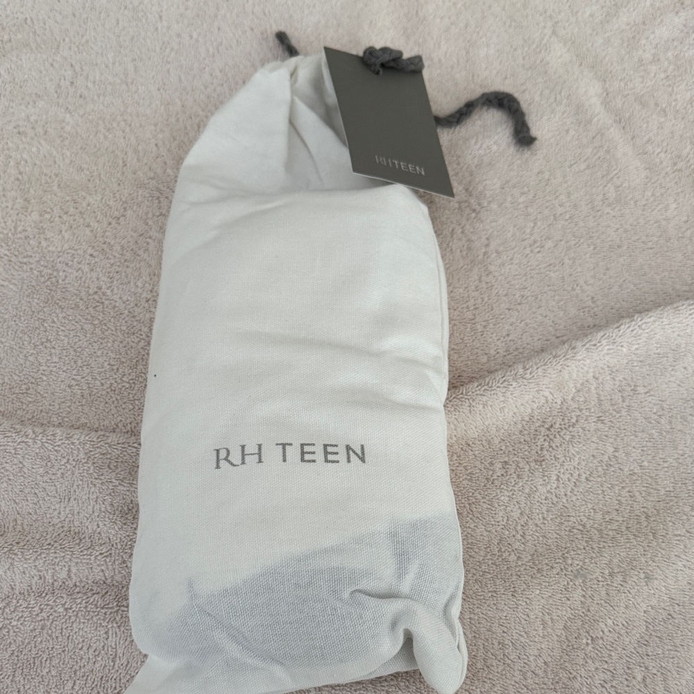 RH Teen White with Navy Trim/Tassel in Standard size 20x26 pillow sham.